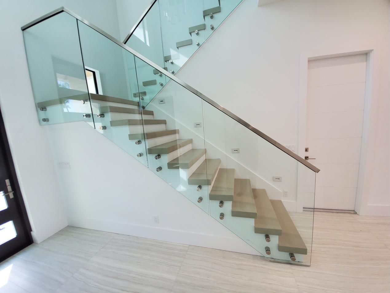 Staircase with frameless glass railing