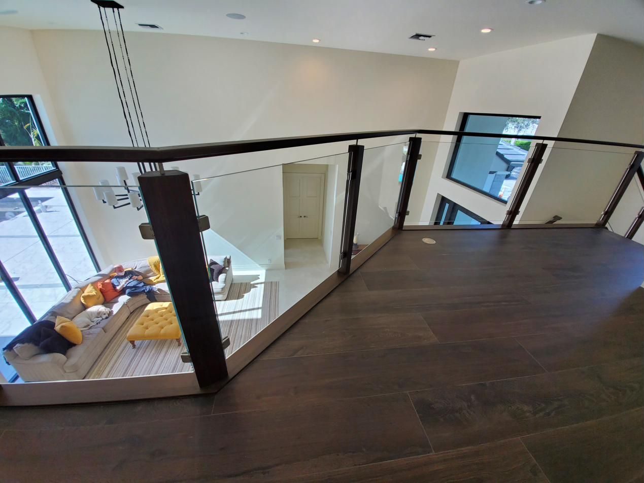 Landing with framed glass railing
