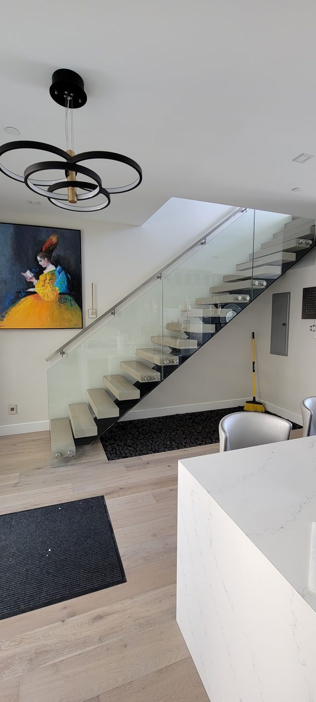 Floating staircase with standoff glass railing