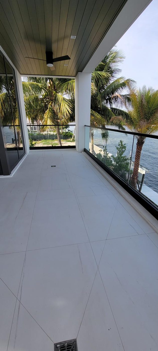 Wood staircase with frameless glass