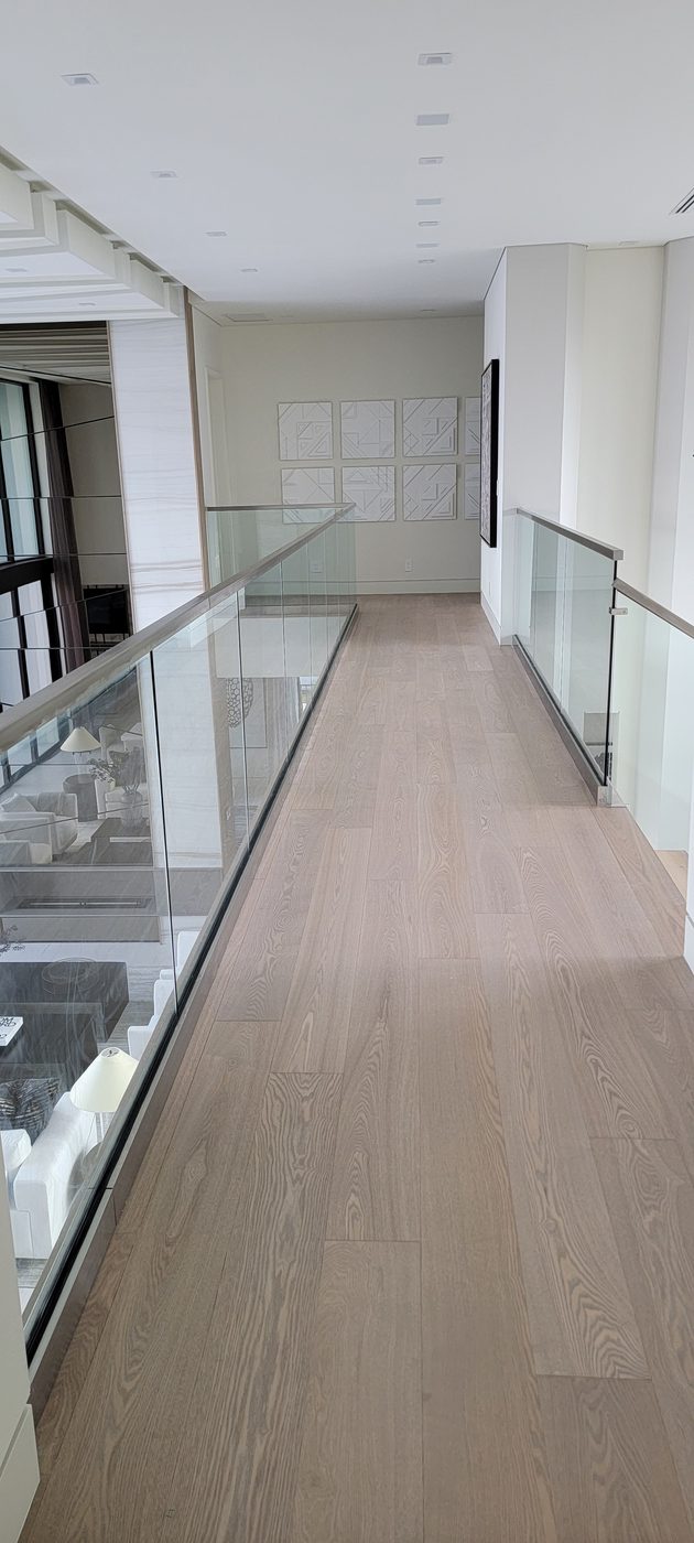 Switchback staircase with frameless glass