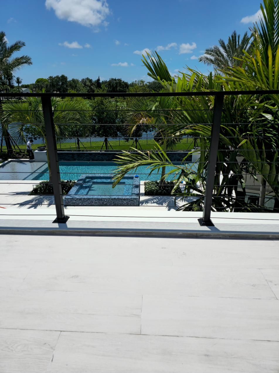 Exterior cable railing overlooking the pool