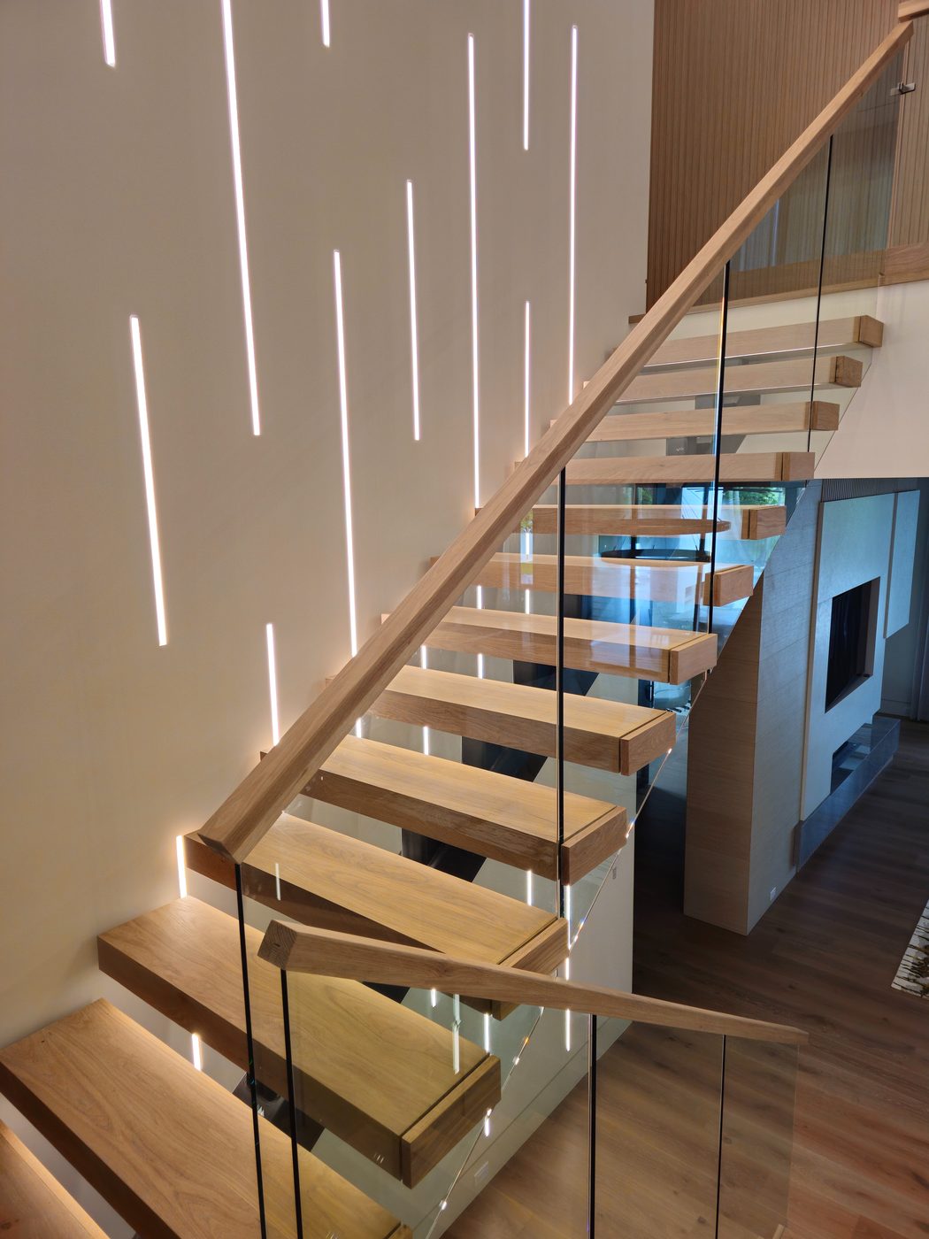 Floating staircase with LED feature wall